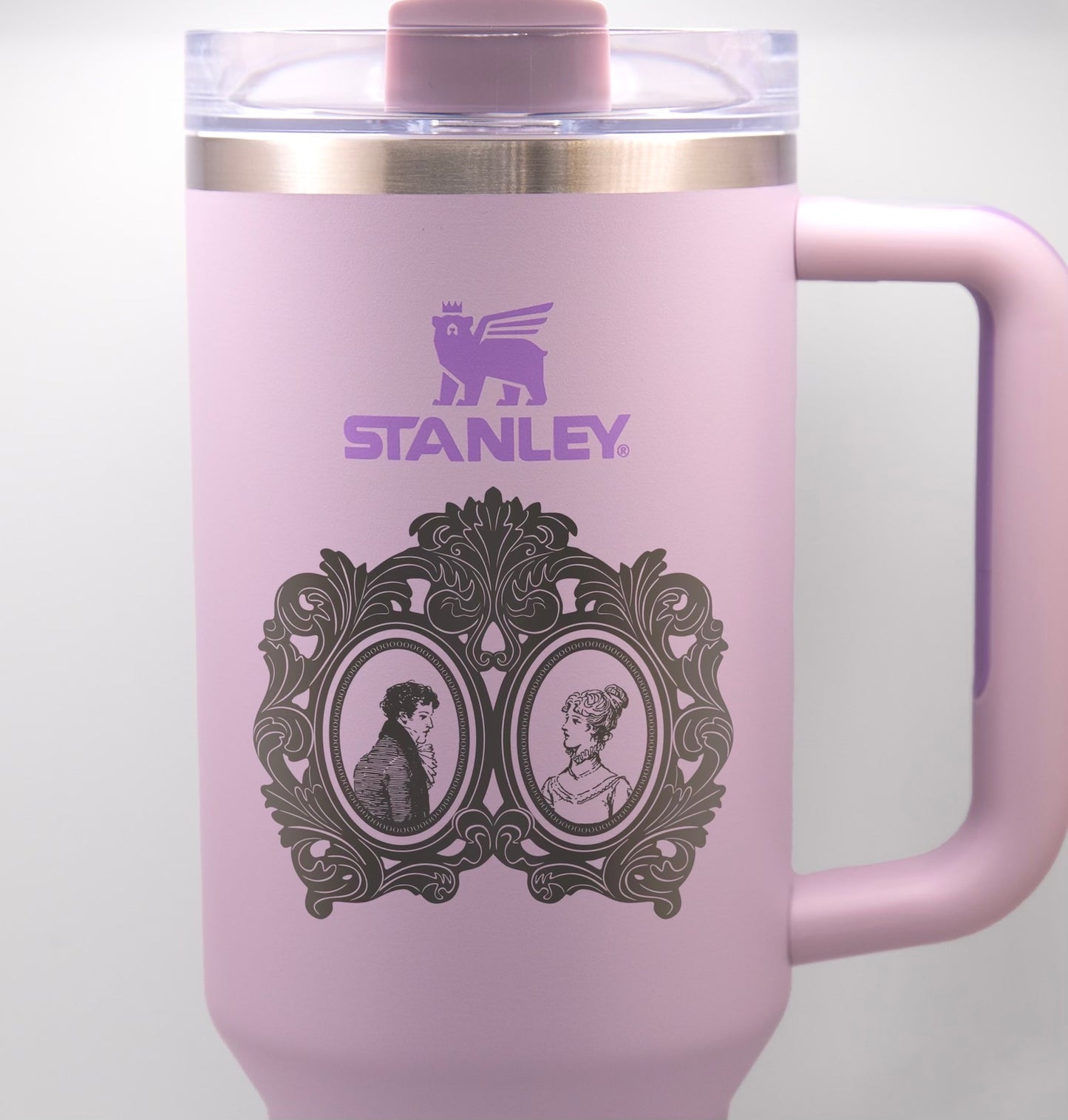 a pink travel mug with a picture of two people on it