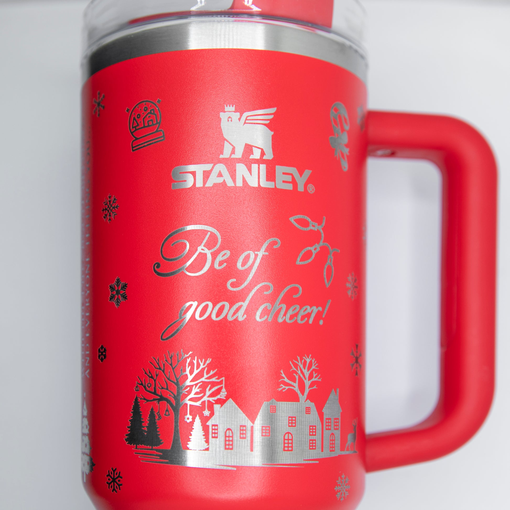 a red coffee mug with the words stanley on it