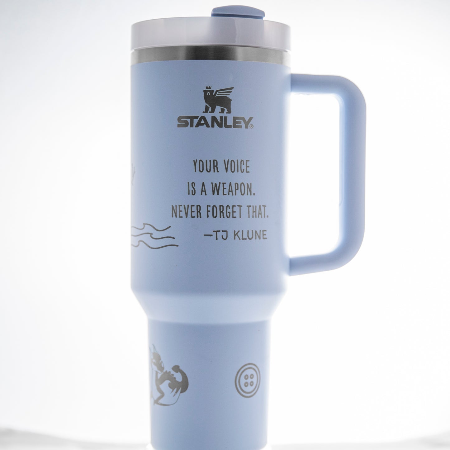 a white travel mug with a slogan on it