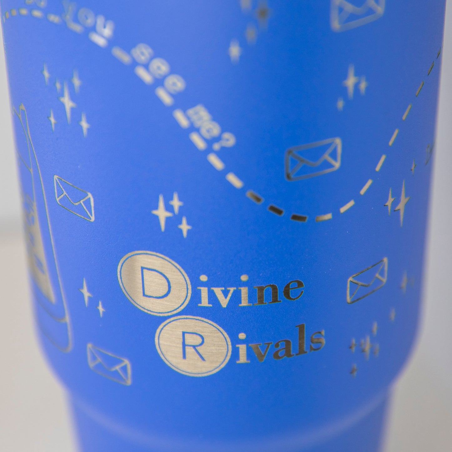 a close up of a blue cup with writing on it