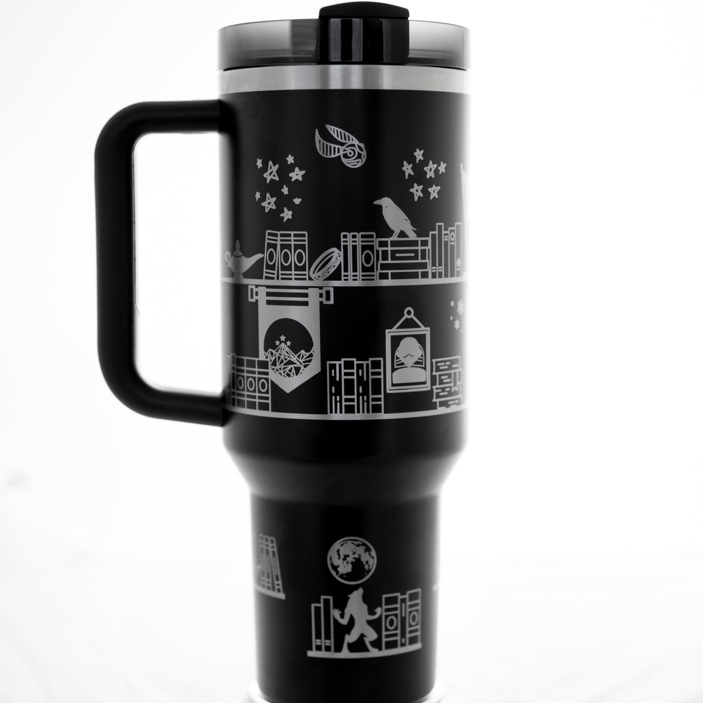 a black and white photo of a travel mug