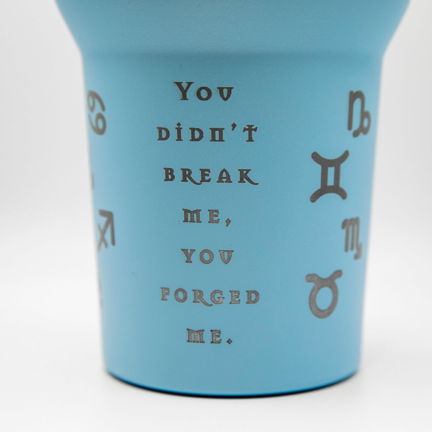 a cup that has some writing on it