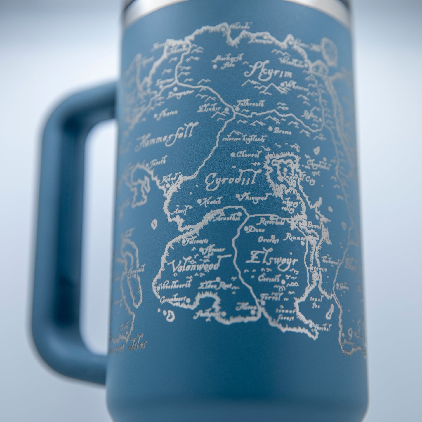 a blue travel mug with a map on it