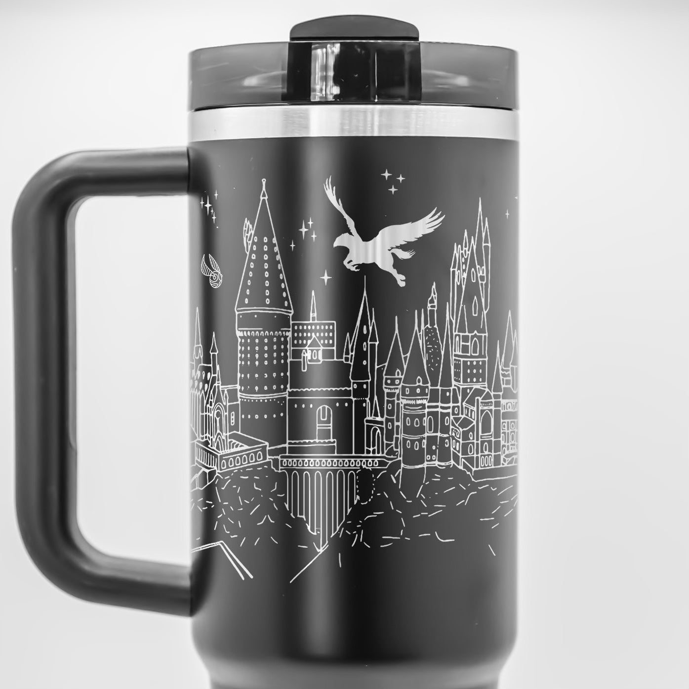 a black and white photo of a travel mug