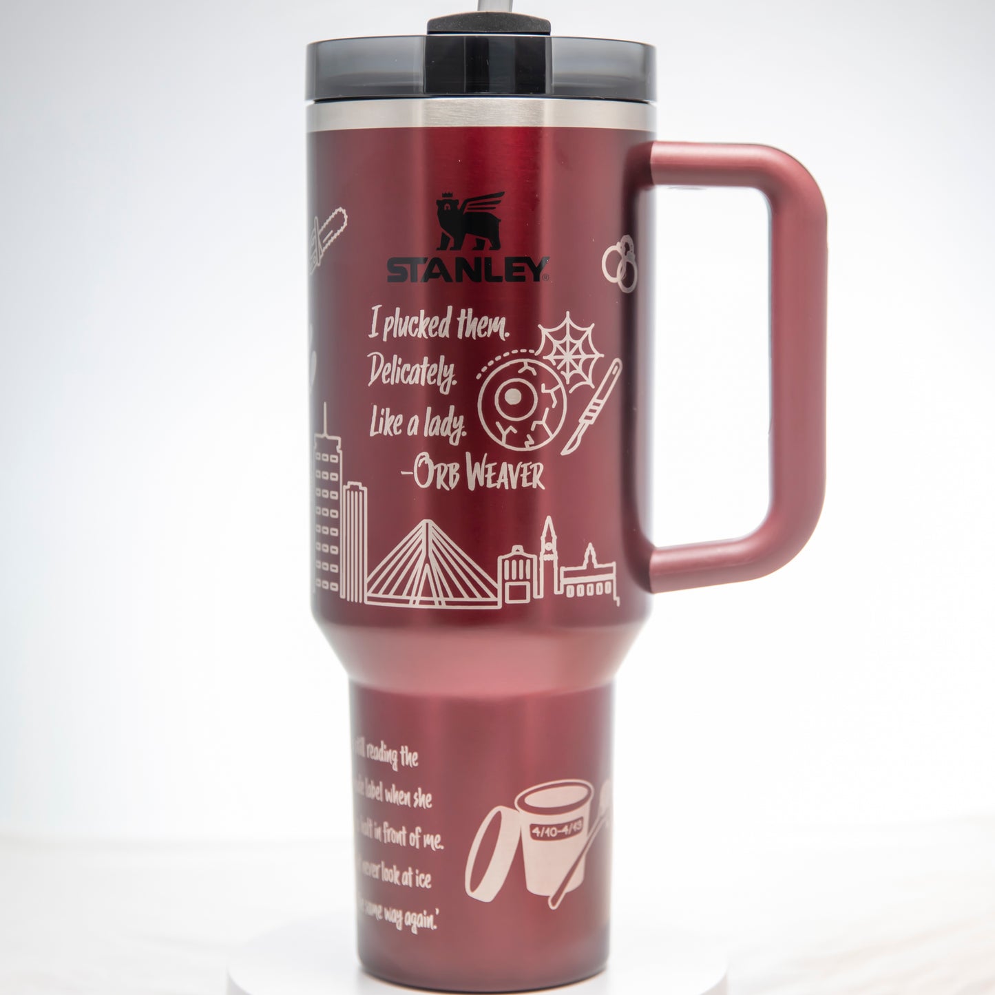 a red travel mug with a black lid