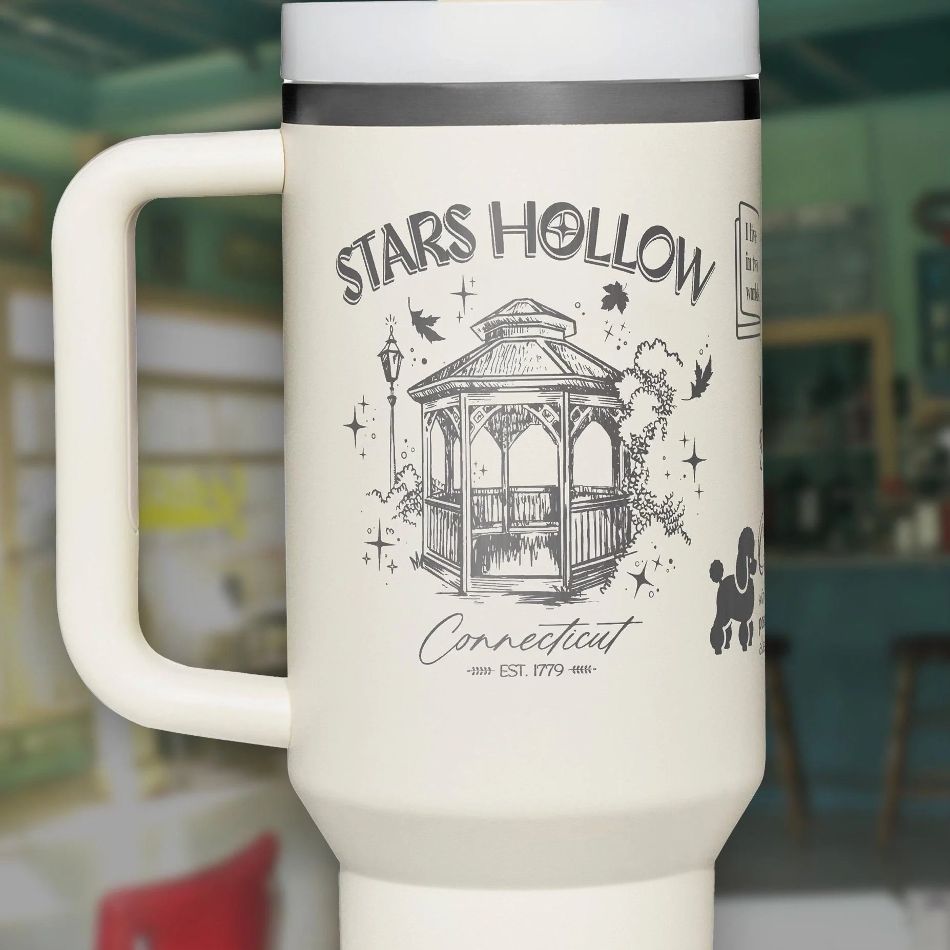 a white coffee cup with a picture of a gazebo on it