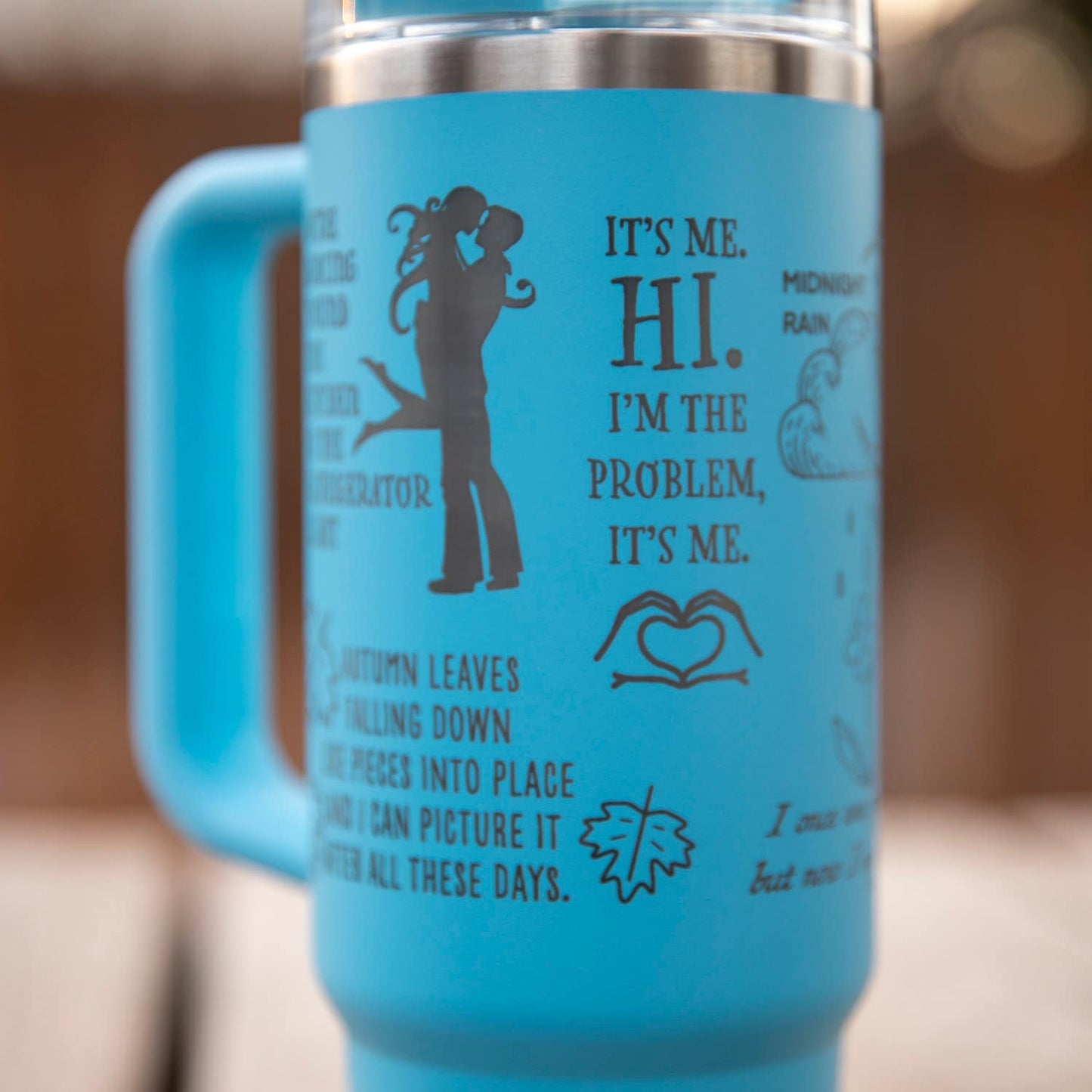 a blue coffee mug with a picture of a man and woman on it