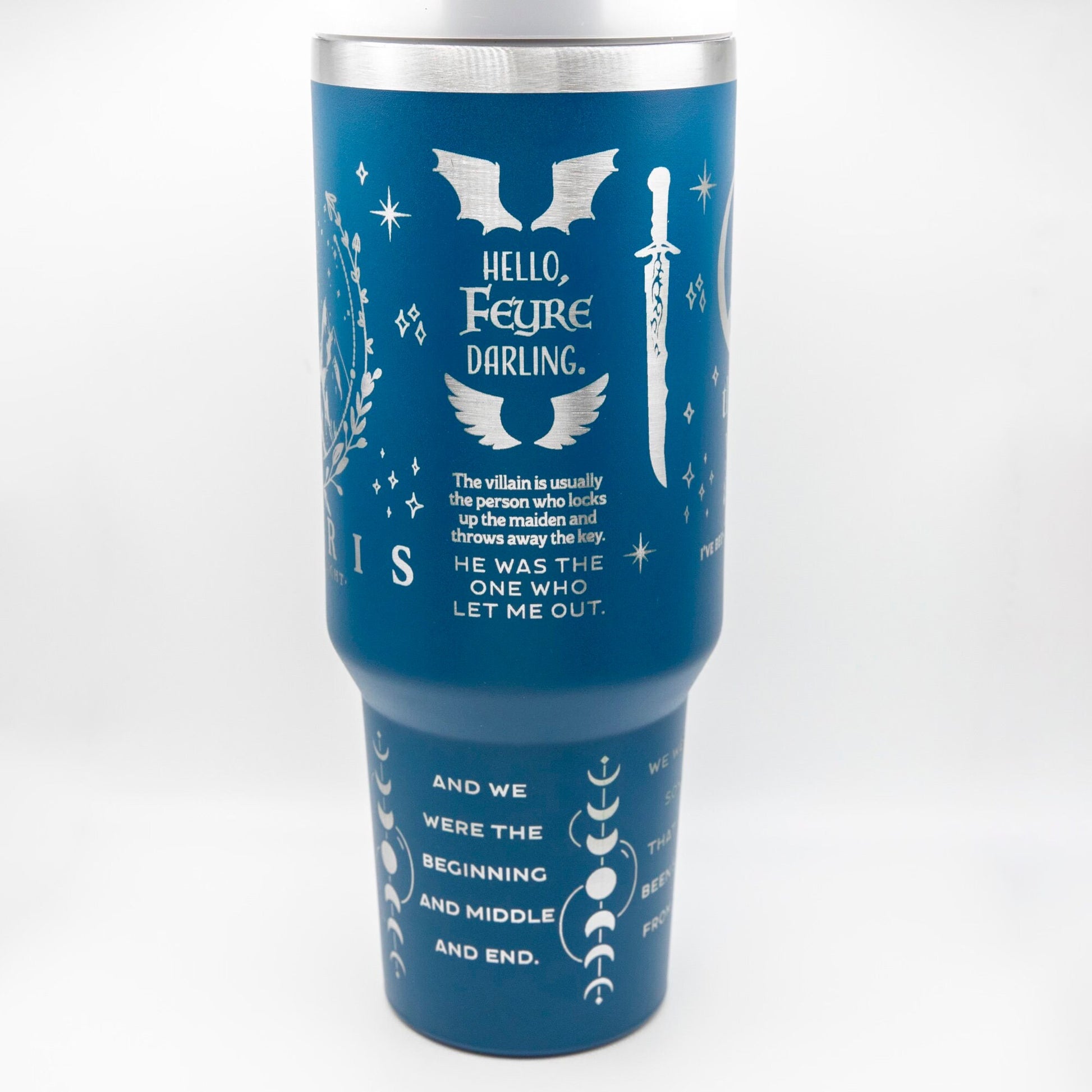 a blue travel mug with white writing on it