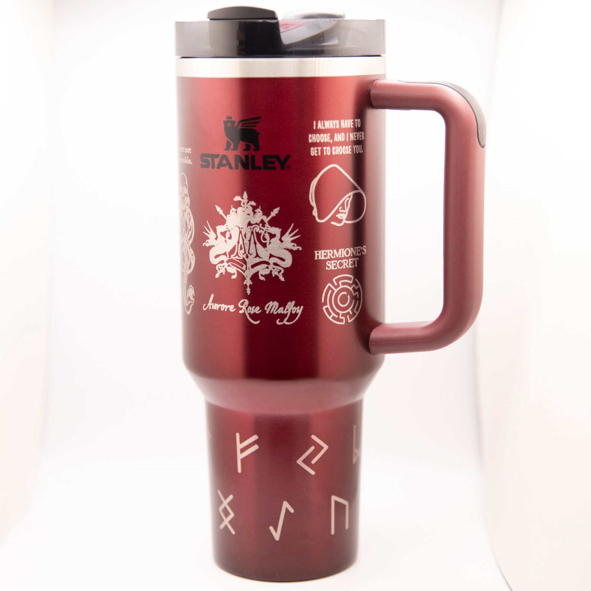 a red travel mug with a handle on a white background