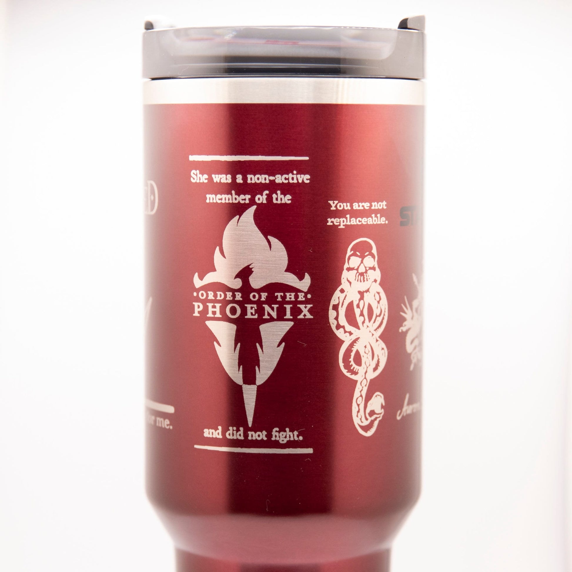 a red travel mug with a picture of a woman on it