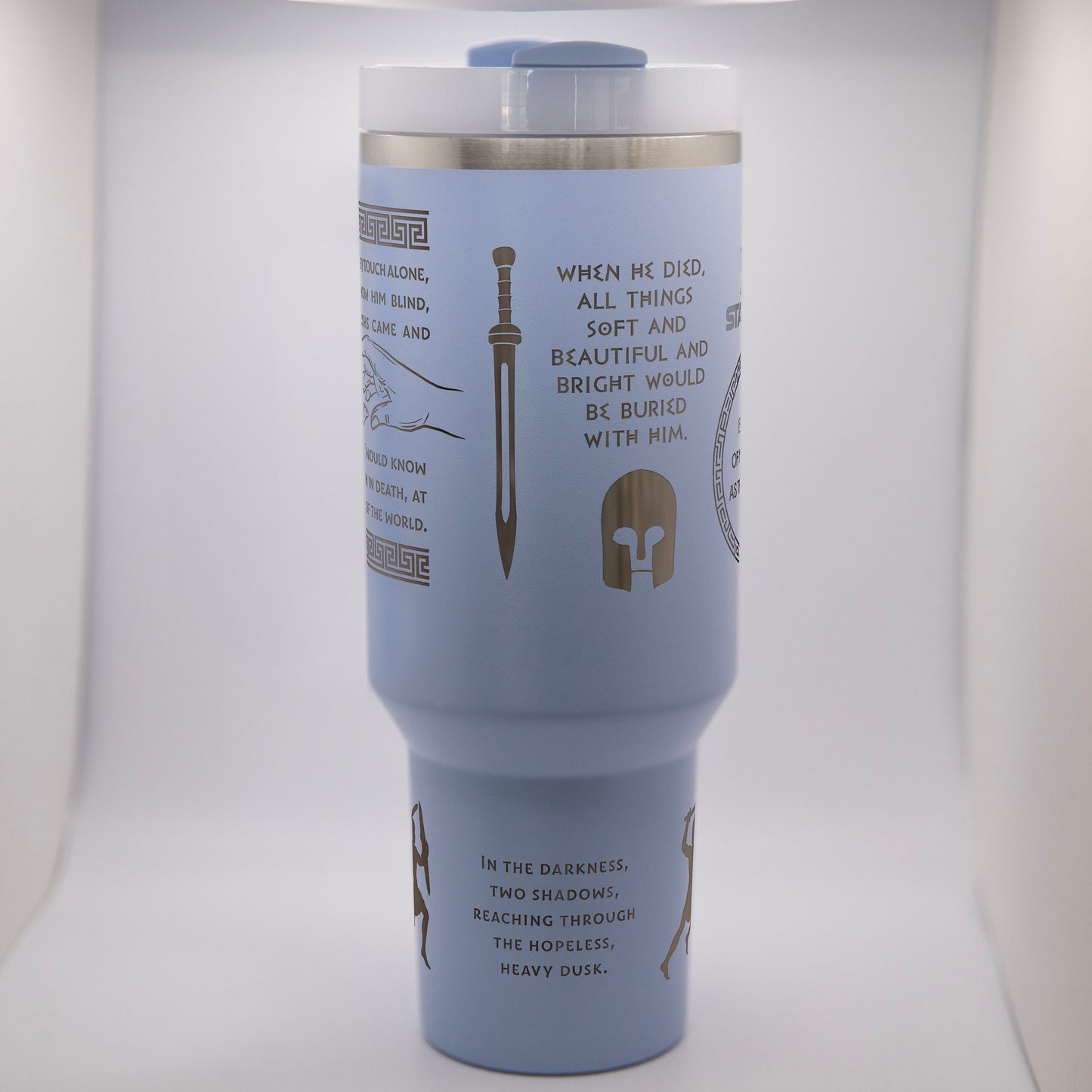 a blue travel mug with writing on it