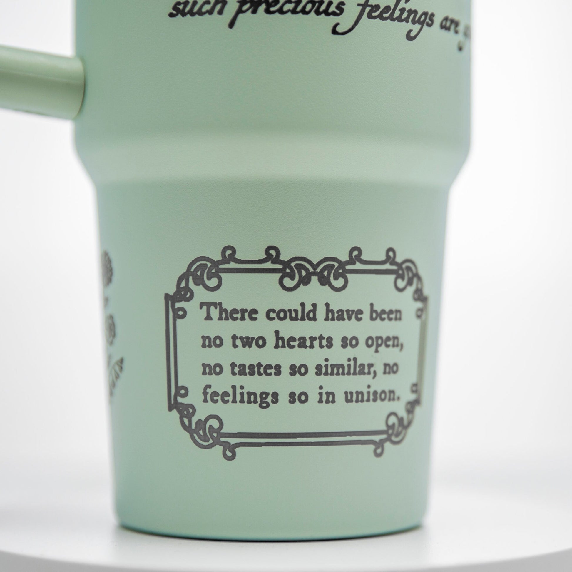 a cup with a quote on it sitting on a table