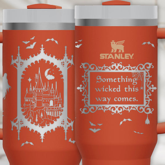 a red travel mug with a picture of a castle on it