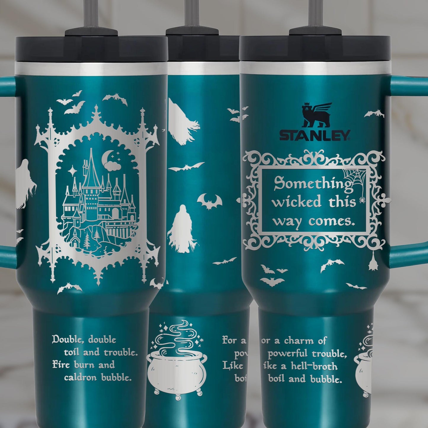 three travel mugs with a picture of a castle on them