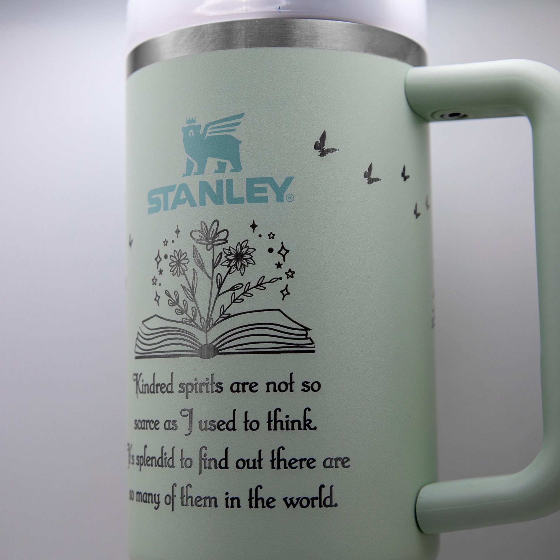 a stainless steel coffee mug with a quote on it