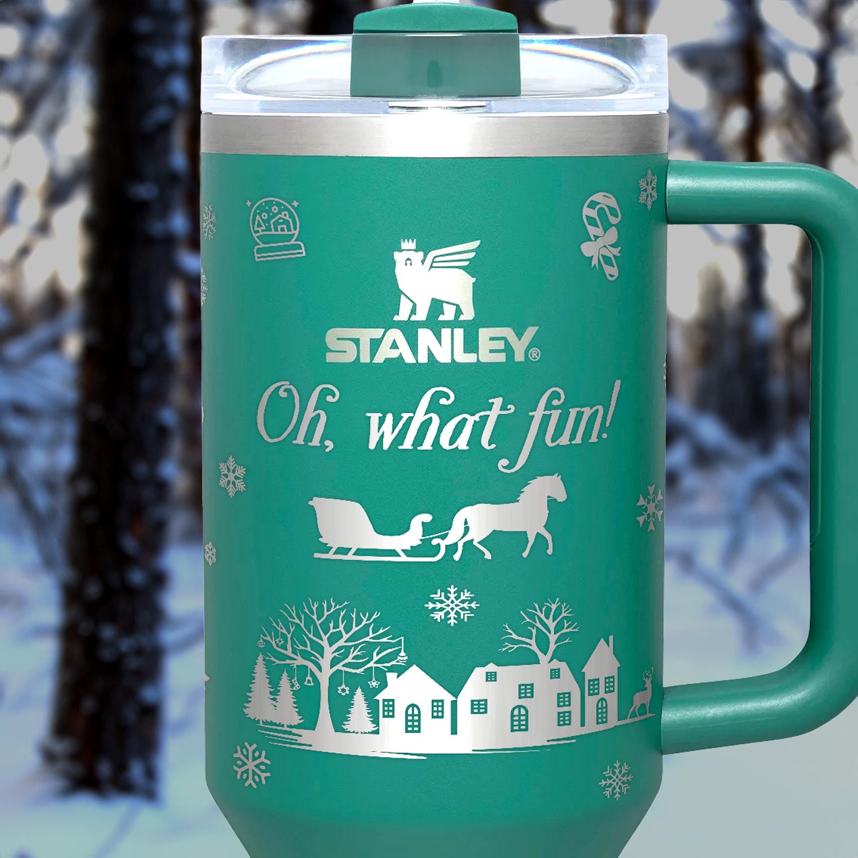 a green travel mug with a picture of a horse drawn sleigh